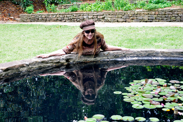 Karen Duquette playing in the Iris Garden pond